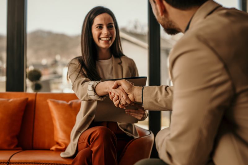 Job interview handshake: A life event like starting a new job can significantly impact your taxes.