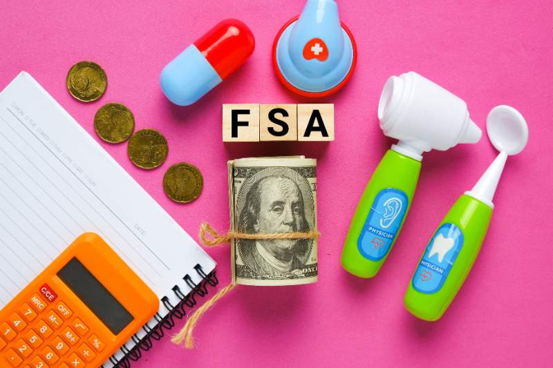 Medical toys representing health care expenses for a Flexible Spending Account (FSA) to lower taxes.