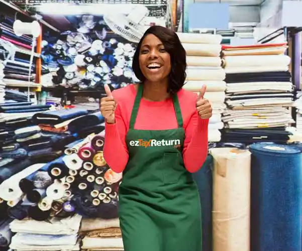 Happy women wearing an ezTaxReturn apron giving two thumbs up